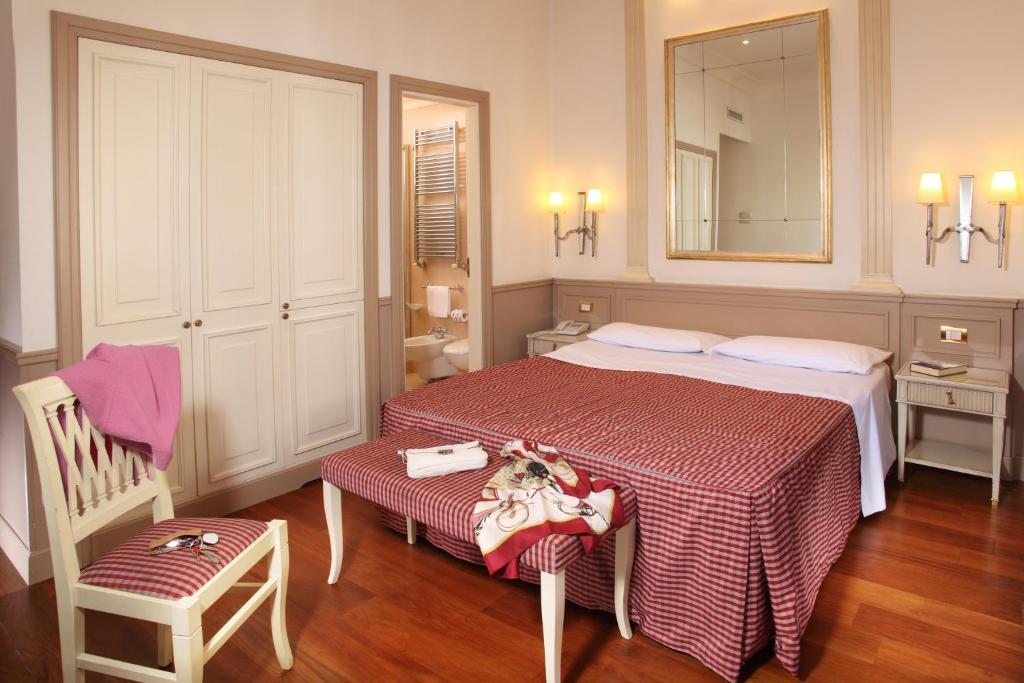 Postel nebo postele na pokoji v ubytování Hotel Villa Glori