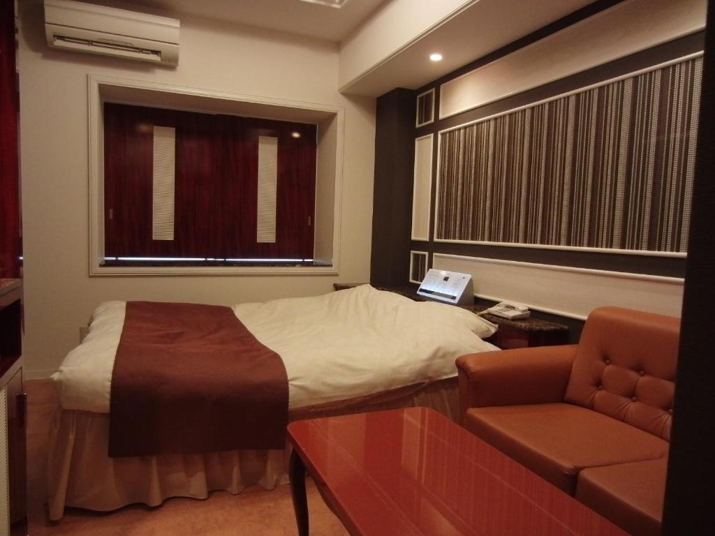 Postel nebo postele na pokoji v ubytování Hotel Hyper Noah (Adult Only)
