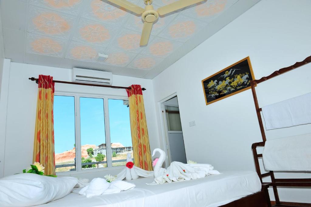 Postel nebo postele na pokoji v ubytování Hotel Glee