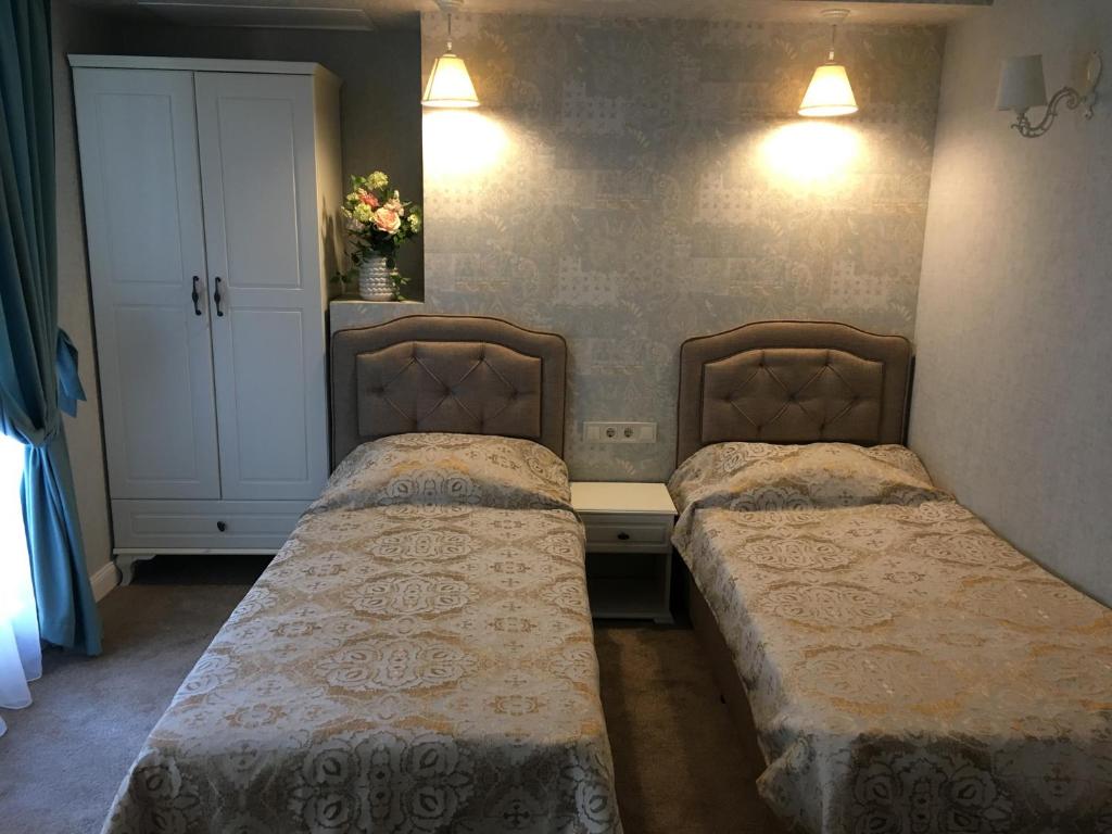Postel nebo postele na pokoji v ubytování Family Hotel Agoncev