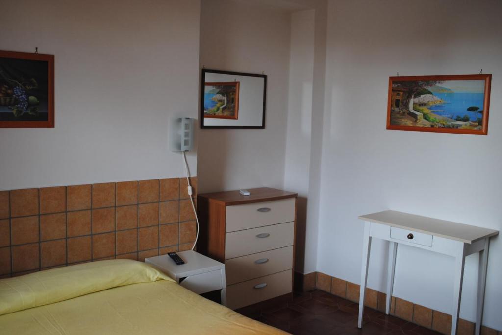 Postel nebo postele na pokoji v ubytování Hotel Mastropeppe