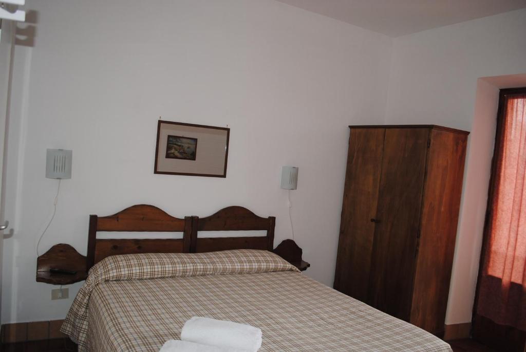 Postel nebo postele na pokoji v ubytování Hotel Mastropeppe
