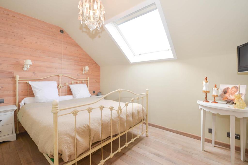 Postel nebo postele na pokoji v ubytování B&B Les Secrets de la Vie