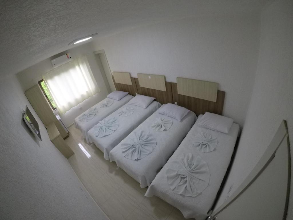 Postel nebo postele na pokoji v ubytování Hotel Dove