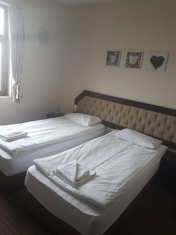 Postel nebo postele na pokoji v ubytování Hotel Podkovata