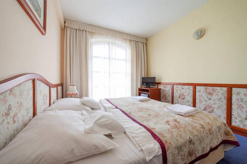 Posteľ alebo postele v izbe v ubytovaní Hotel Bobbio