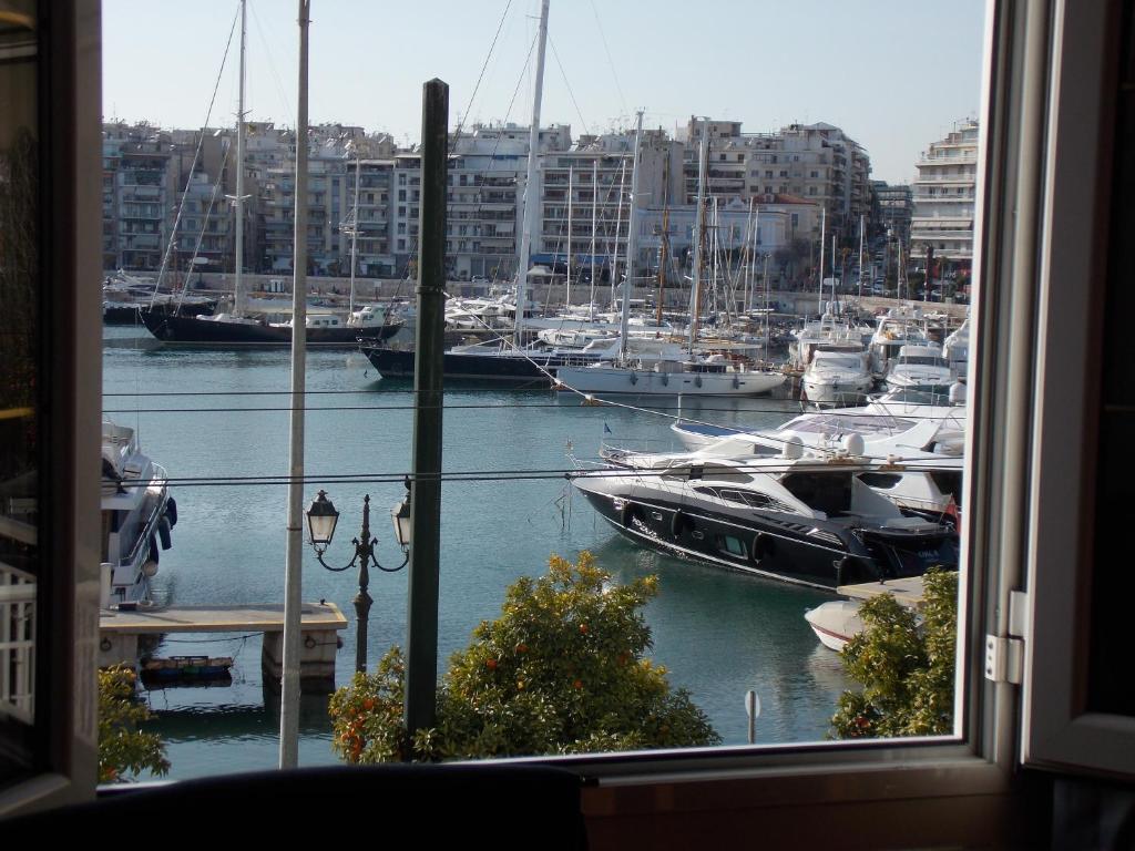 a view of a marina with boats in the water at Pasalimani Long Beach in Piraeus