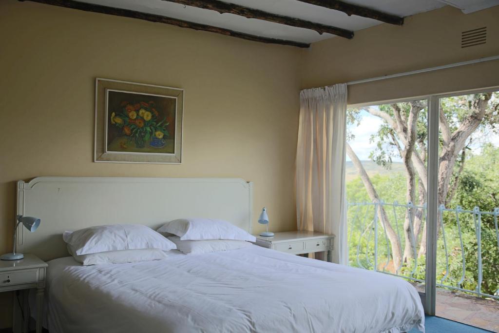 A bed or beds in a room at Bateleur Nature Reserve