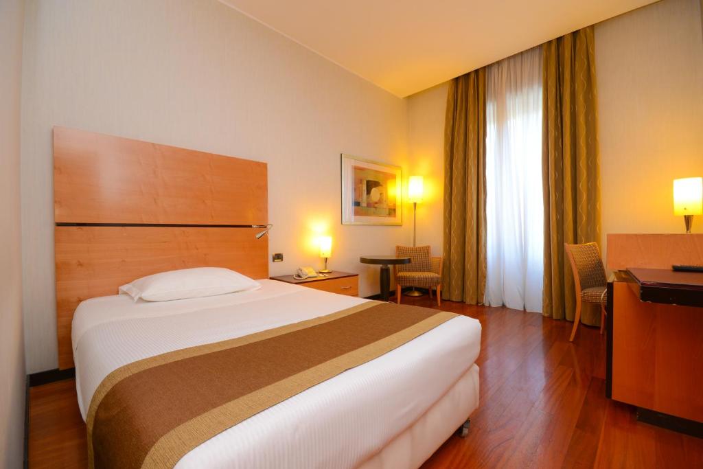 Postel nebo postele na pokoji v ubytování Hotel Igea