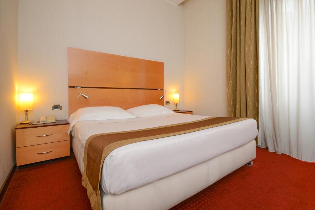 Postel nebo postele na pokoji v ubytování Hotel Igea