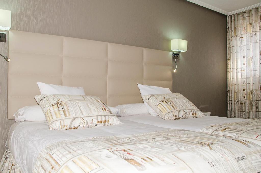 Cama o camas de una habitación en Hotel Presa