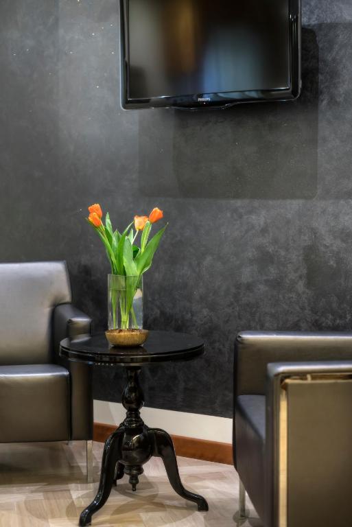 TV a/nebo společenská místnost v ubytování ACasaMia WelcHome Hotel