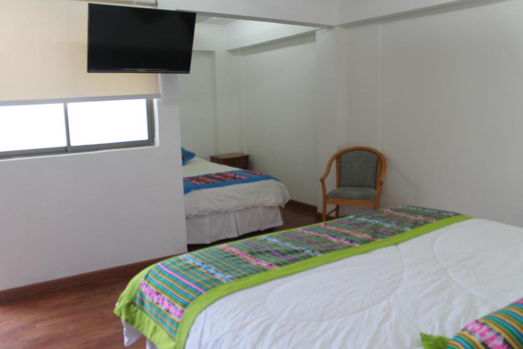 Postel nebo postele na pokoji v ubytování Hotel Samaña