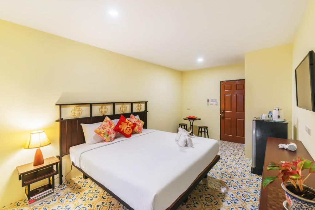 Postel nebo postele na pokoji v ubytování Le Hua Hotel