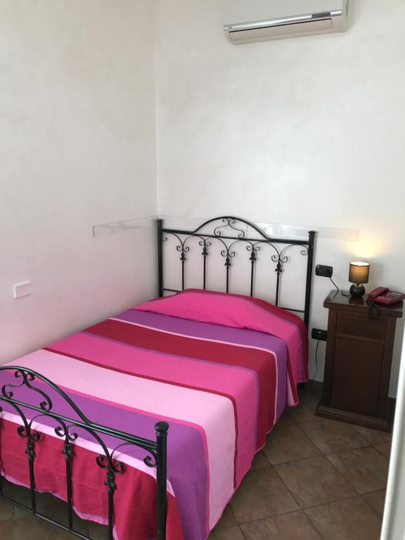 Postel nebo postele na pokoji v ubytování Hotel Toscano