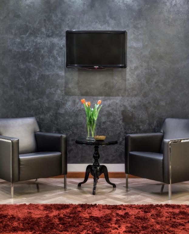 TV a/nebo společenská místnost v ubytování ACasaMia WelcHome Hotel