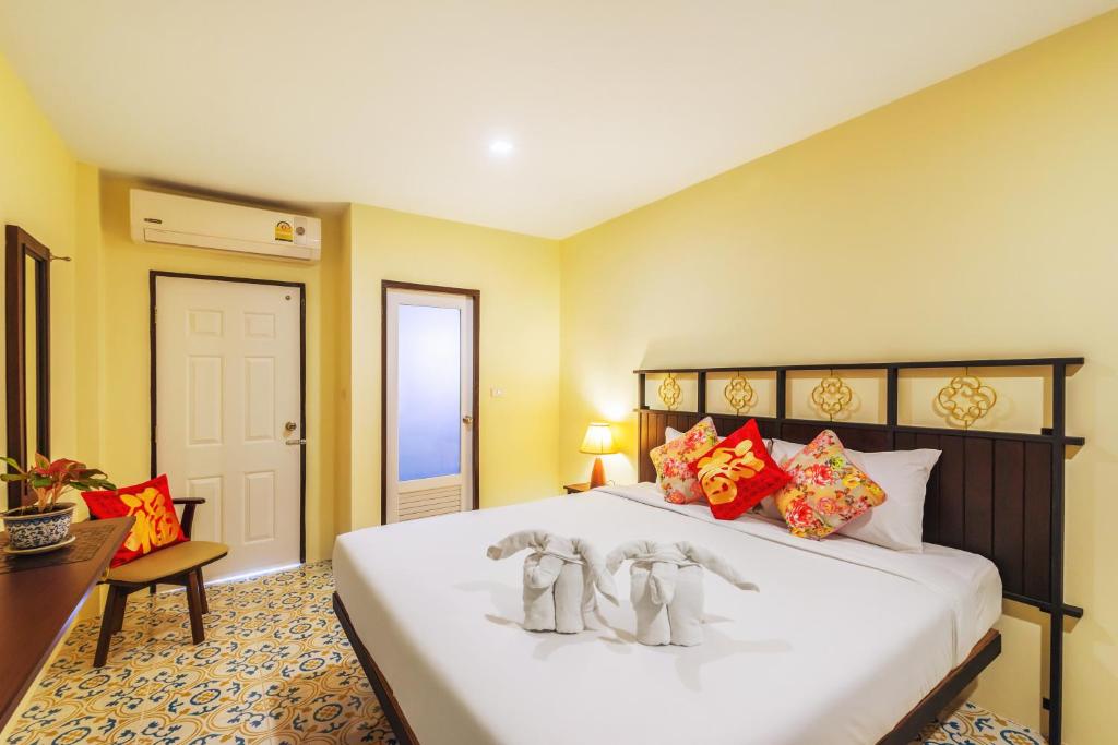 Postel nebo postele na pokoji v ubytování Le Hua Hotel