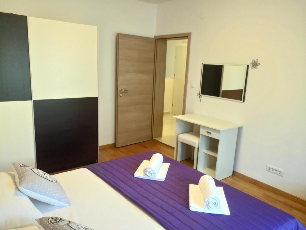 Posteľ alebo postele v izbe v ubytovaní Petra apartment