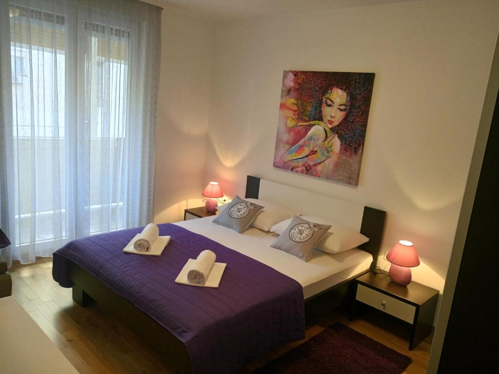 Posteľ alebo postele v izbe v ubytovaní Petra apartment