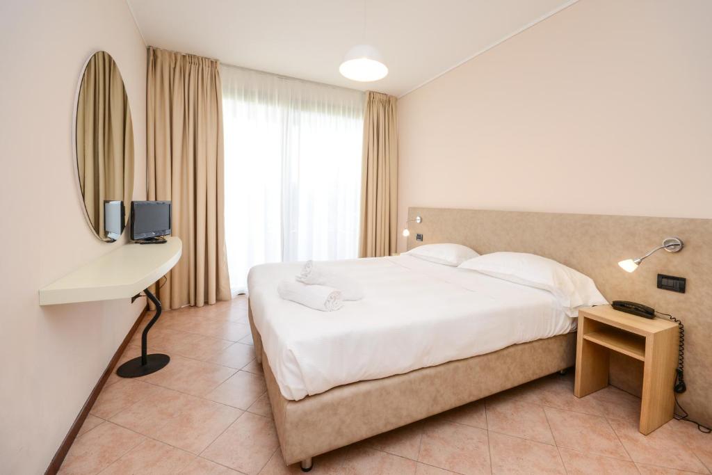 Łóżko lub łóżka w pokoju w obiekcie Il Sogno Apartments