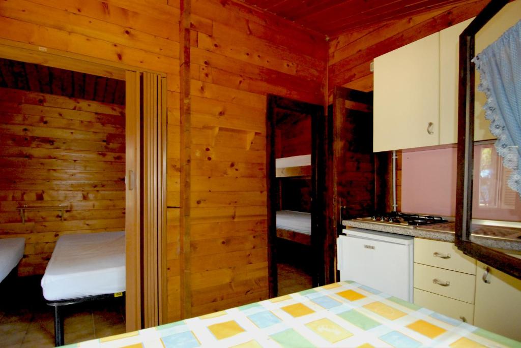 Kuchyň nebo kuchyňský kout v ubytování Villaggio Camping Uria