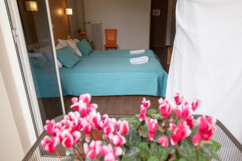 Postel nebo postele na pokoji v ubytování Myrto Hotel