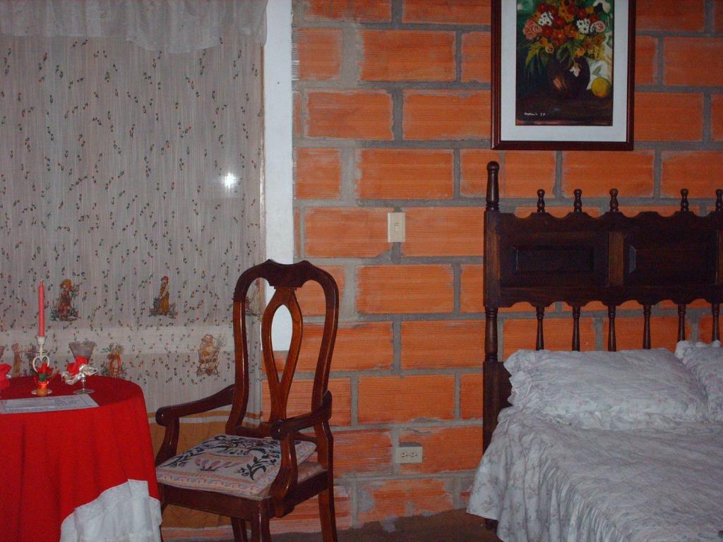 Postel nebo postele na pokoji v ubytování Finca Hotel Nutabes