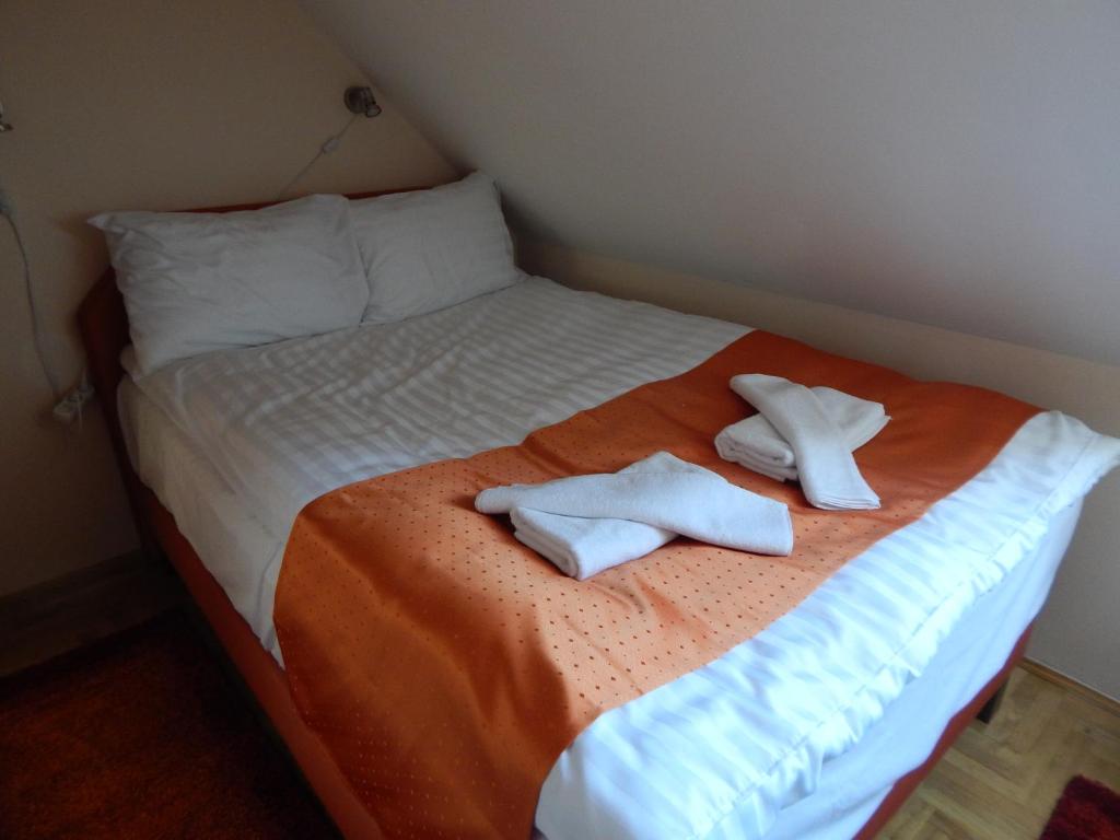 Postel nebo postele na pokoji v ubytování Sport Hotel