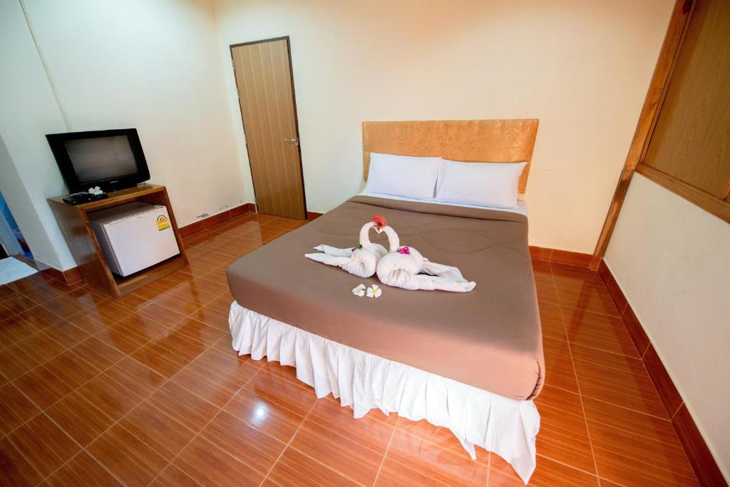 Postel nebo postele na pokoji v ubytování Poonsap Resort