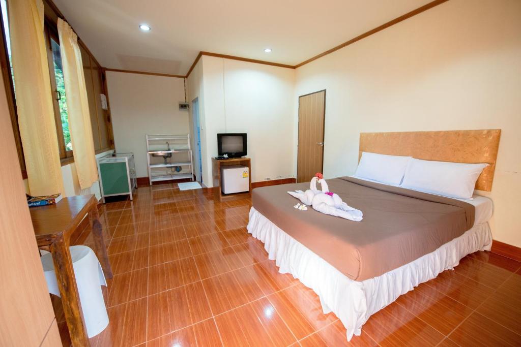 Postel nebo postele na pokoji v ubytování Poonsap Resort