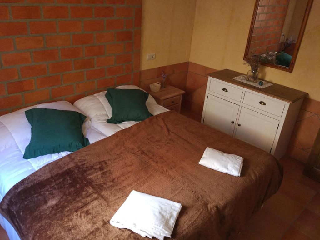 Postel nebo postele na pokoji v ubytování Casa Rural Sierra De Coripe