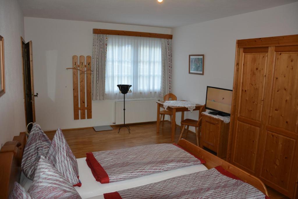 Postel nebo postele na pokoji v ubytování Weingut Seiner vlg. Kraxner