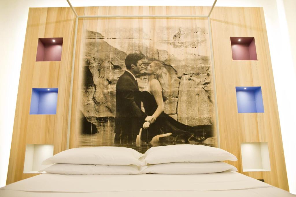 Postel nebo postele na pokoji v ubytování Hotel Corallo Rimini