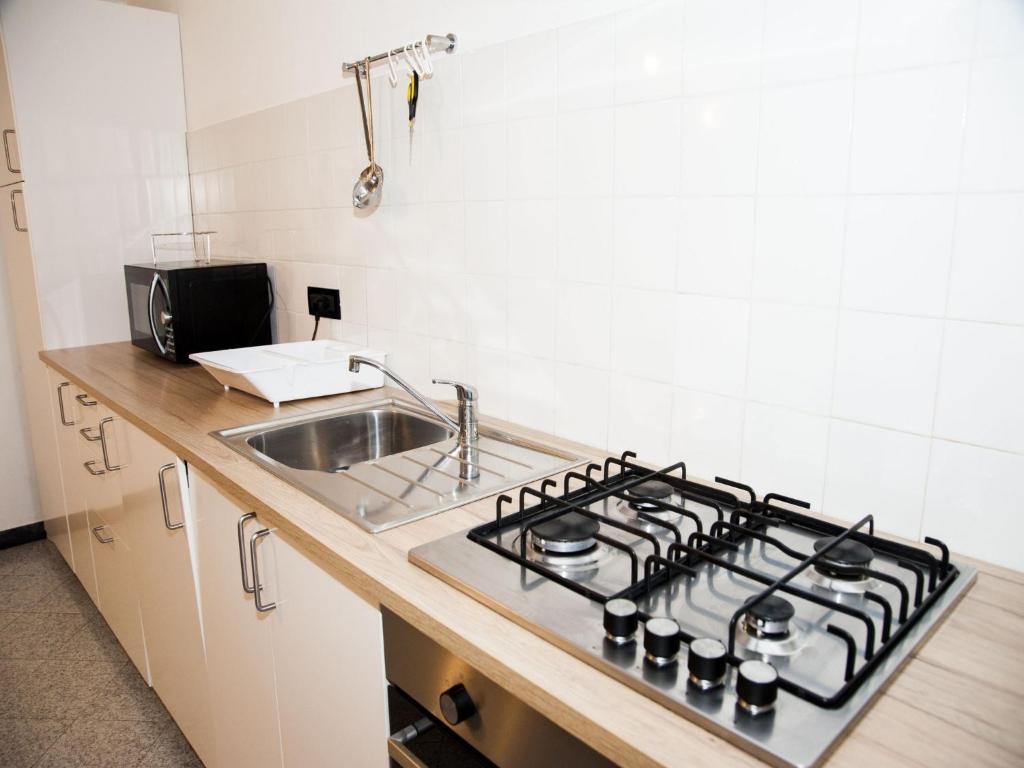 a kitchen with a stove and a sink at Il Leudo in Levanto