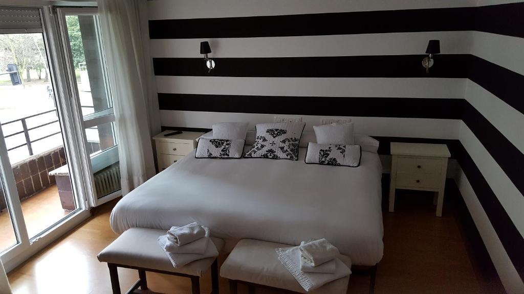 Postel nebo postele na pokoji v ubytování Hostel Costa Gijon