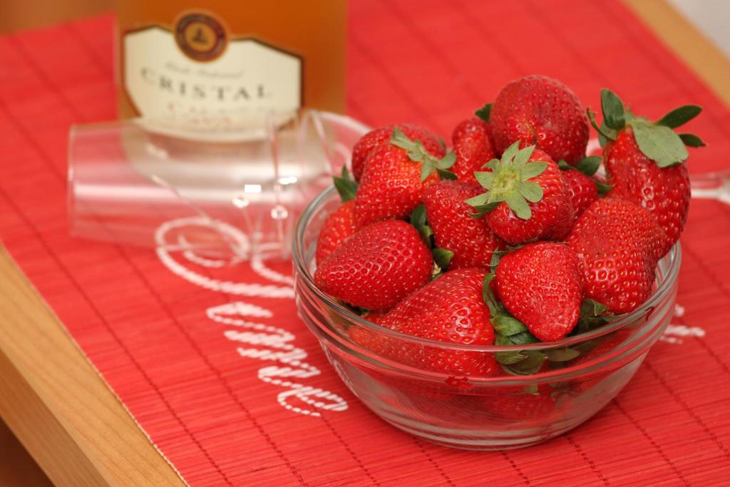 a glass bowl of strawberries sitting on a table at Villa Yvonne in Trogir