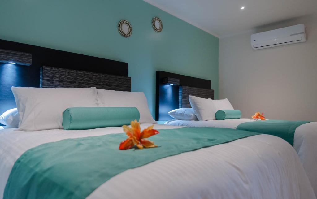 Posteľ alebo postele v izbe v ubytovaní Hotel Mumai