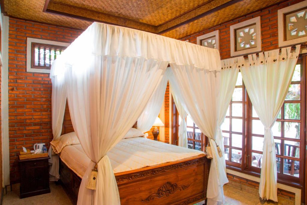 Postel nebo postele na pokoji v ubytování Ari La Homestay