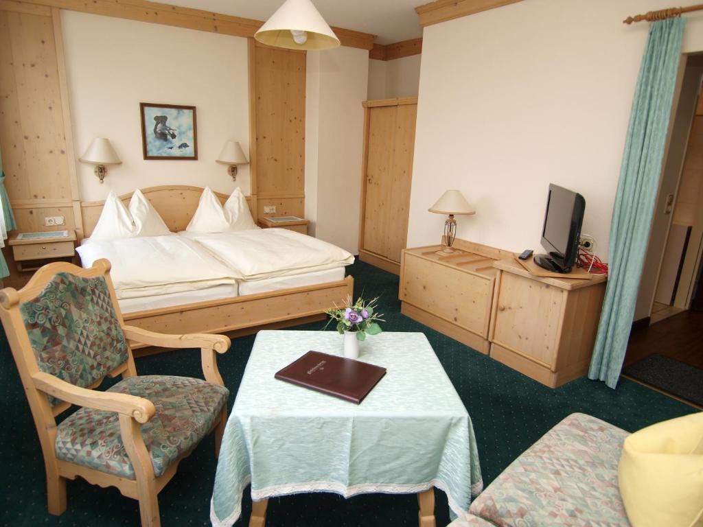 Postel nebo postele na pokoji v ubytování Hotel Krug