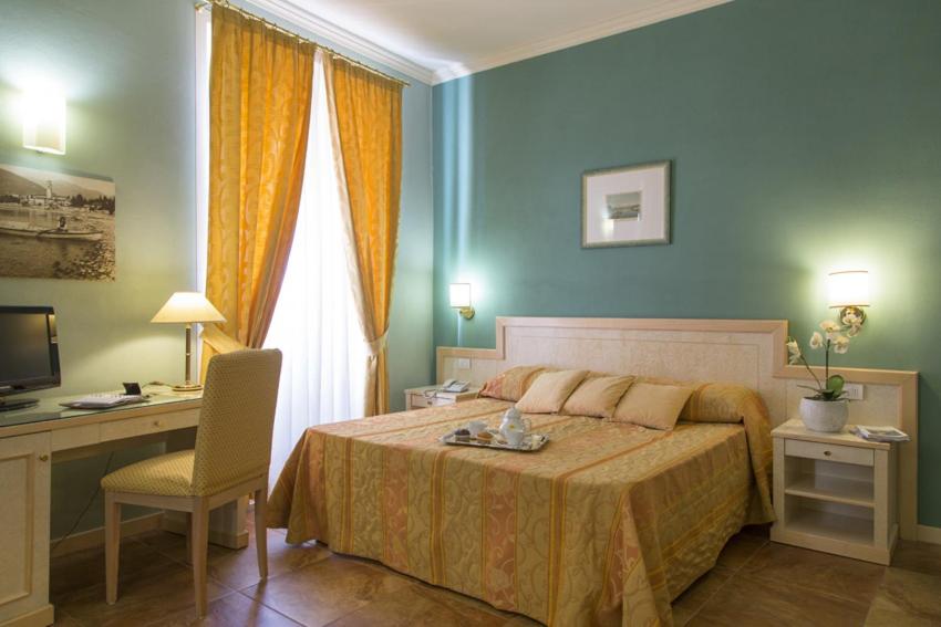 Un ou plusieurs lits dans un hébergement de l'établissement Hotel Belvedere