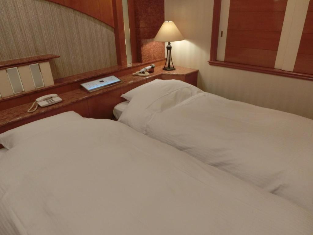 Postel nebo postele na pokoji v ubytování Hotel Hyper Noah (Adult Only)