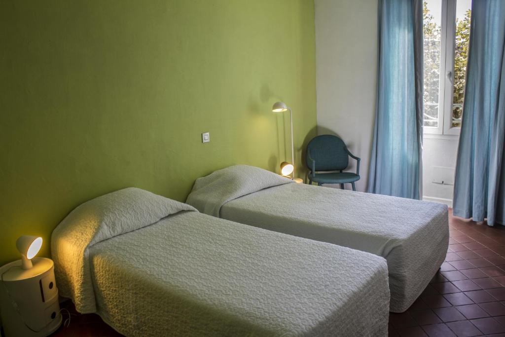 Postel nebo postele na pokoji v ubytování Hotel Burrhus