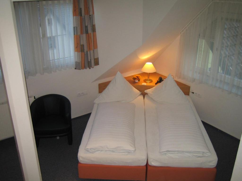 Postel nebo postele na pokoji v ubytování Hotel Wasserfall