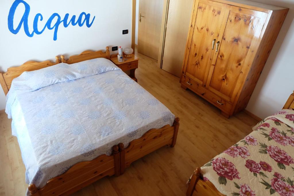Postel nebo postele na pokoji v ubytování Santorsola Relax Hotel