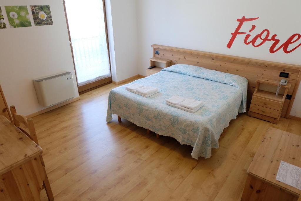 Postel nebo postele na pokoji v ubytování Santorsola Relax Hotel