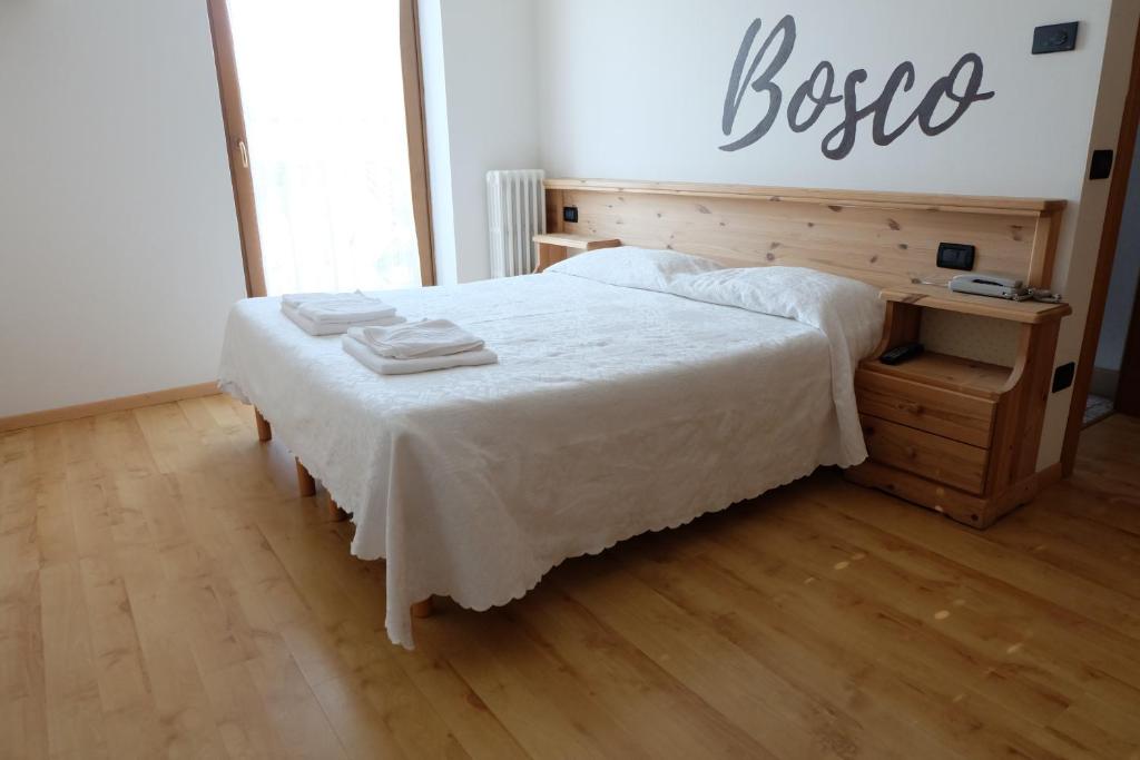 Postel nebo postele na pokoji v ubytování Santorsola Relax Hotel