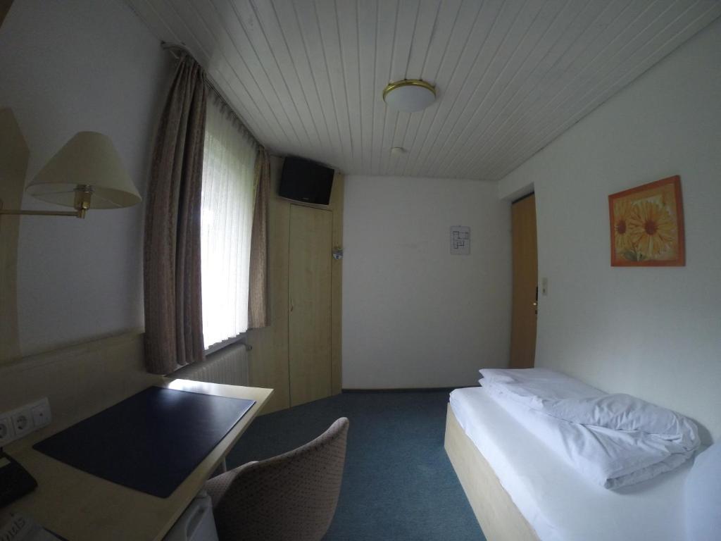 Postel nebo postele na pokoji v ubytování Hotel Wasserfall