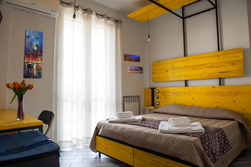 Postel nebo postele na pokoji v ubytování B&B L'Officina di Apollo