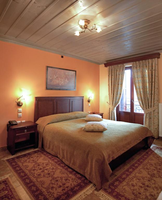 מיטה או מיטות בחדר ב-Amanites Guesthouse