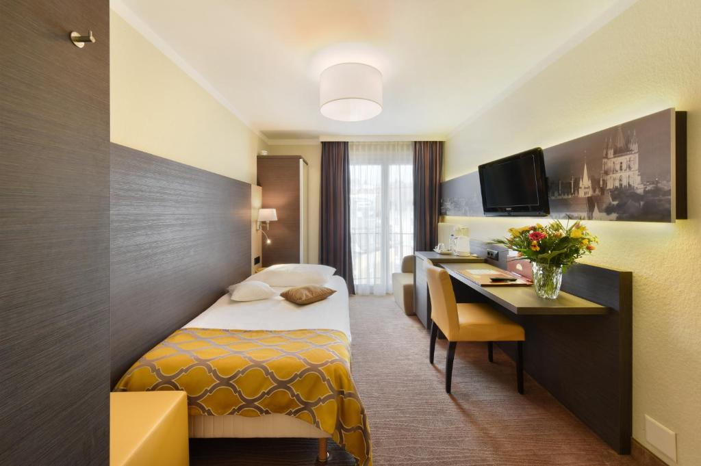 Postel nebo postele na pokoji v ubytování Hôtel Bellerive